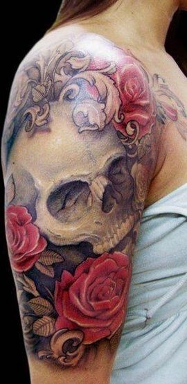 Wonderful combined big skull with colored flowers tattoo on shoulder
