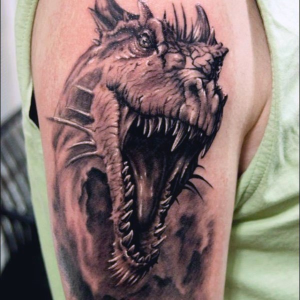 Wonderful detailed black and white dinosaur tattoo on shoulder