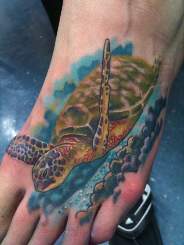 Wonderful floating sea turtle tattoo on foot