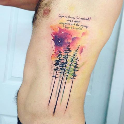 Wonderful looking colored side tattoo of forest with colored clouds and lettering
