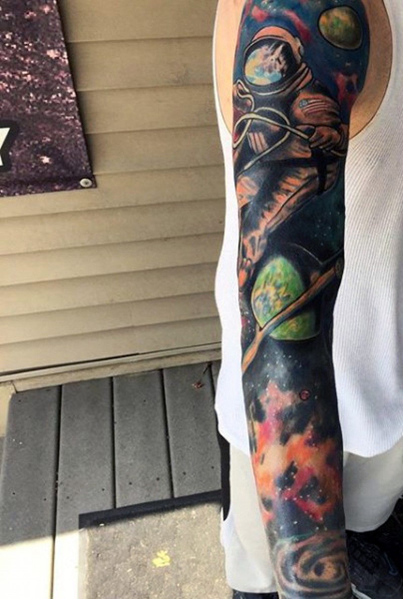 Wonderful multicolored solar system big sleeve tattoo on arm