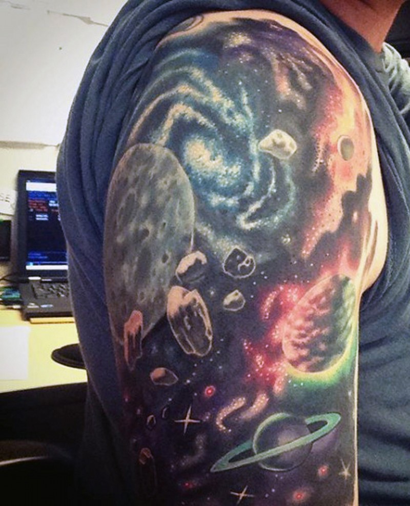 Wonderful painted colorful space tattoo on arm