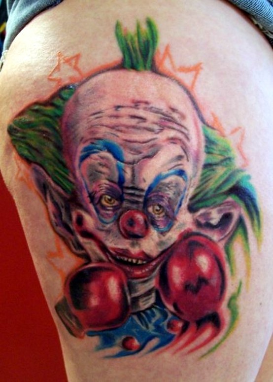 Wonderful painted multicolored evil clown boxer tattoo on thigh
