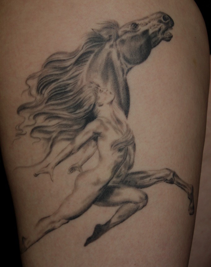 Wonderful running woman and horse tattoo on thigh