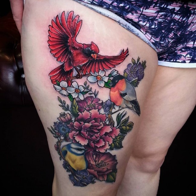 Wonderful style colored thigh tattoo of birds and blooming tree branch