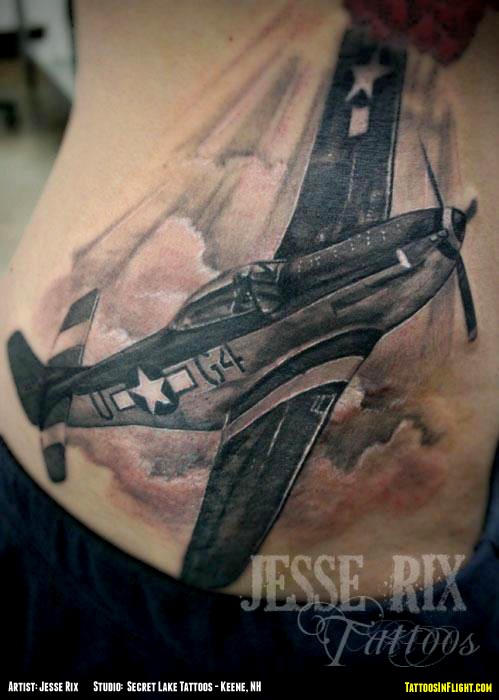 WW2 themed very detailed belly tattoo of fighter plane