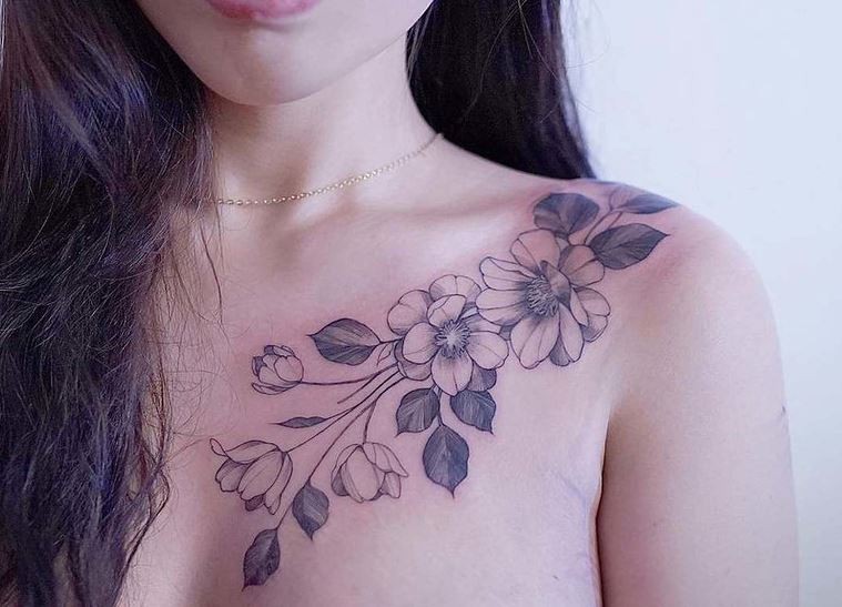 Zihwa typical linework style collarbone tattoo of flowers