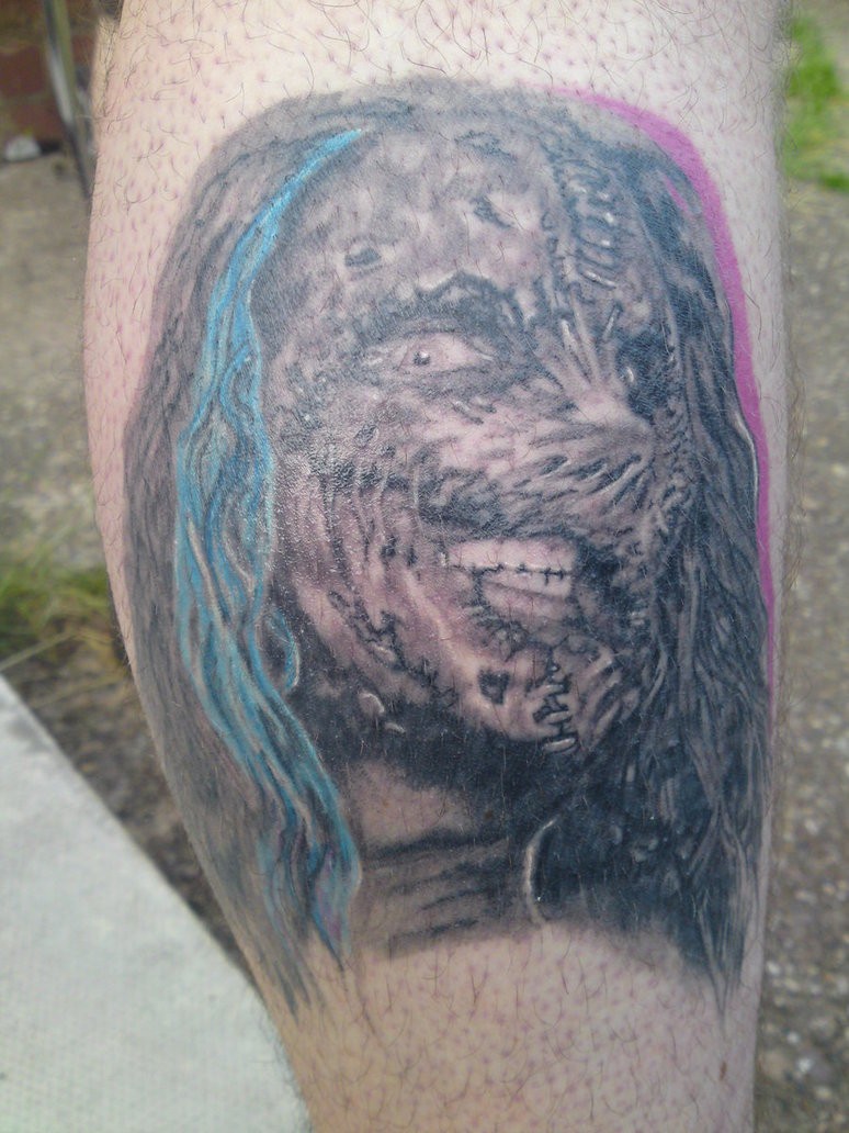Zombie head tattoo on forearm